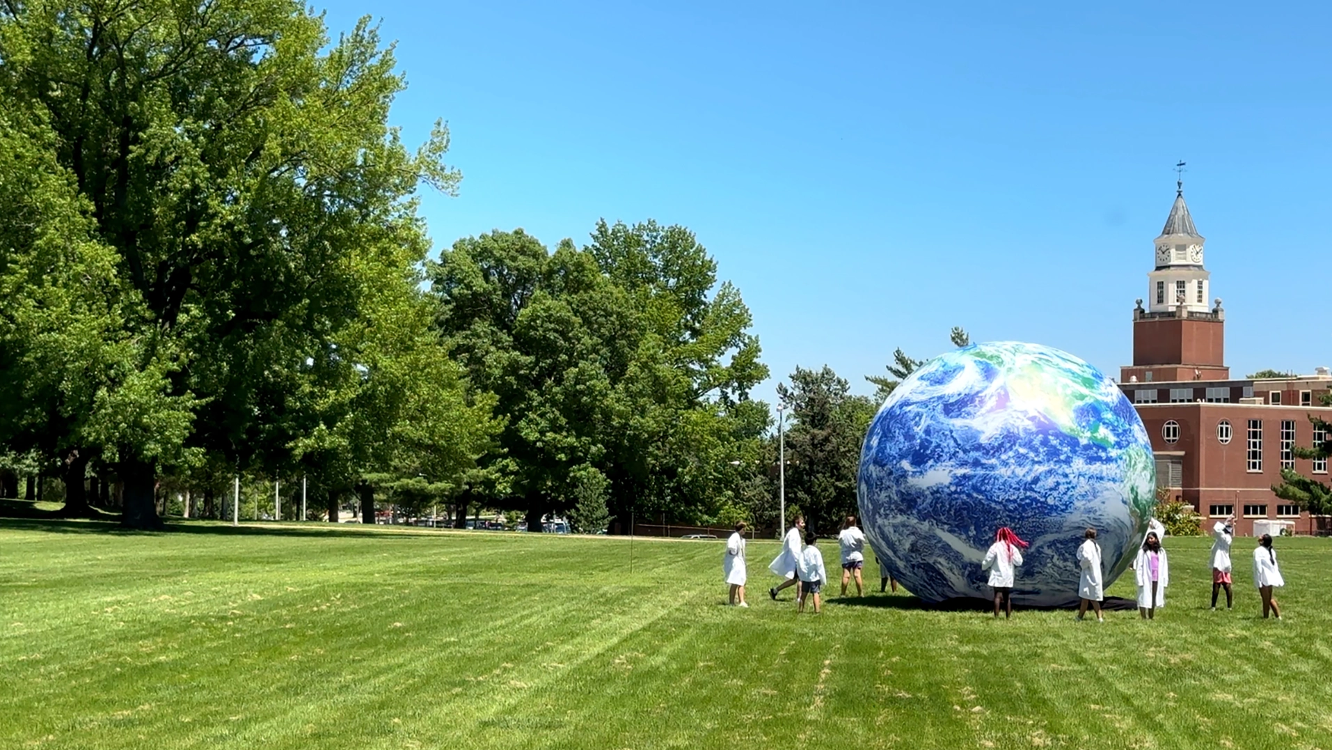 SIU STEM Staff members standing together in front of a campus building